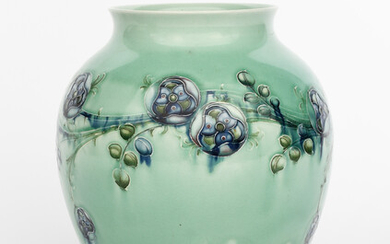 'Tudor Rose' a Moorcroft Pottery vase designed by William Moorcroft