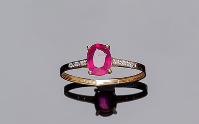 Yellow gold ring with an oval ruby center, in...