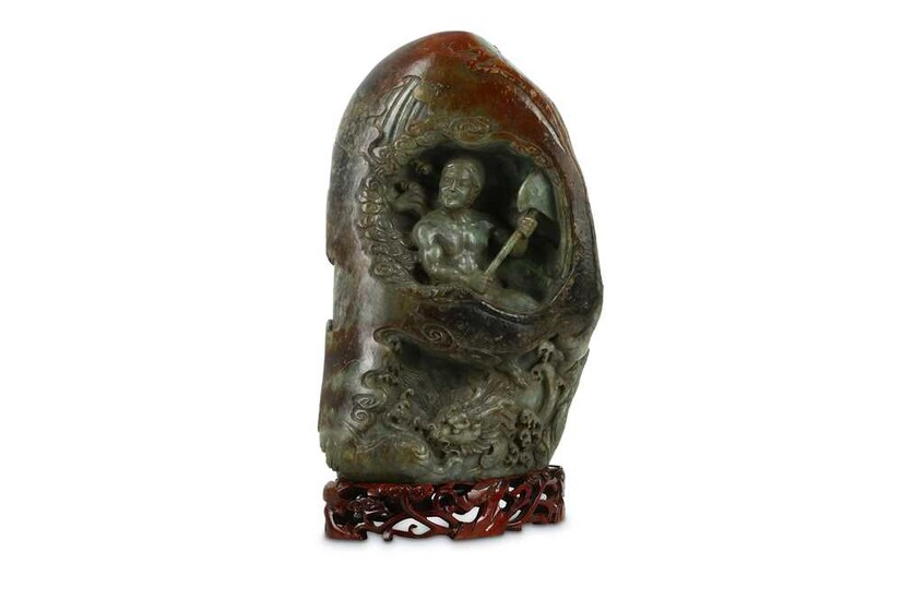 A LARGE CHINESE GREY AND RUSSET JADE BOULDER. Carved...