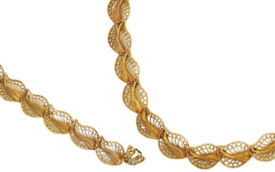 18K gold bracelet and necklace set in a unique...