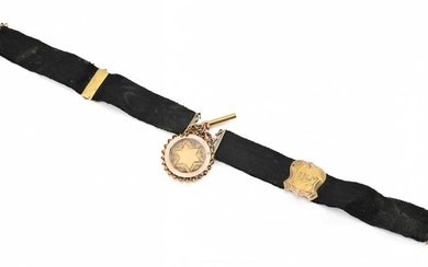 AN ANTIQUE FOB MEDALLION ON GROSGRAIN, WITH 9CT GOLD FITTINGS