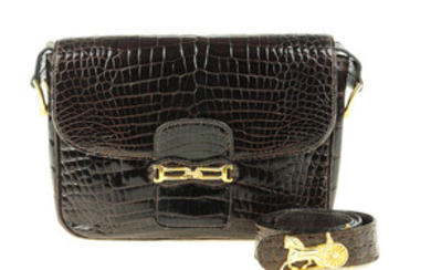 CÉLINE - a vintage crocodile handbag with matching belt. View more details