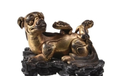 A Chinese gilt-bronze ‘lion’ scroll weight