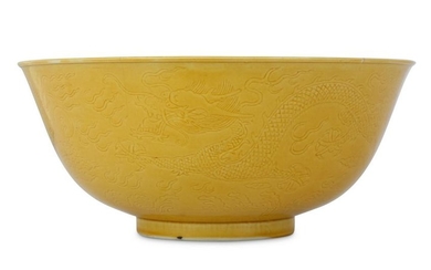 A CHINESE MUSTARD-GLAZED ANHUA 'DRAGON' BOWL.