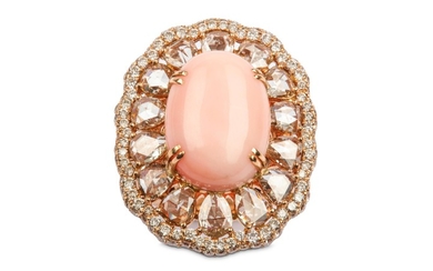 A coral and diamond cluster ring The oval...