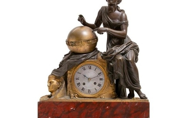 A French bronze and rouge marble mantel clock