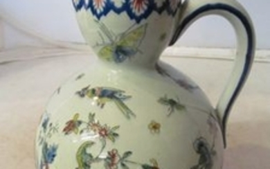 A Gien French Faience 19th Century jug of floral cornucopia design.