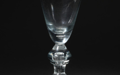 A heavy baluster wine glass, circa 1720