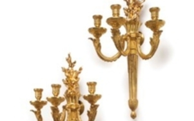 A PAIR OF LOUIS XVI ORMOLU THREE-BRANCH WALL LIGHTS, CIRCA 1775, AFTER A DESIGN BY RICHARD LALONDE