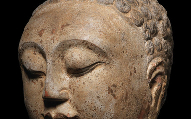 A superb carved polychrome limestone head of Buddha