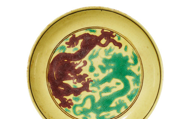 A YELLOW-GROUND AUBERGINE AND GREEN-ENAMELLED ‘DRAGON’ DISH, KANGXI SIX-CHARACTER MARK IN AUBERGINE ENAMEL WITHIN A DOUBLE CIRCLE AND OF THE PERIOD (1662-1722)