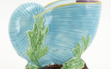 MAJOLICA SPOON WARMER ATTRIBUTED TO GEORGE JONES In the form of a nautilus shell on a naturalistic base with seaweed. Unmarked. Heig...