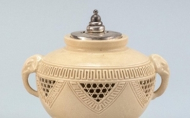 POTTERY CENSER In ovoid form with elephant's-head handles. Pierced sides and tripod base. Replaced cover. Signed. Height 5.75".