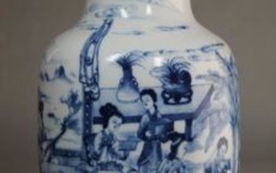 A Chinese blue and white baluster vase painted with figures around a table, six character mark to base, 21.5cm.