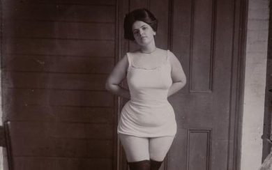 BELLOCQ, E. J. (1873-1949) [Storyville portrait, New Orleans, woman in underclothes standing on rug, about 1900]