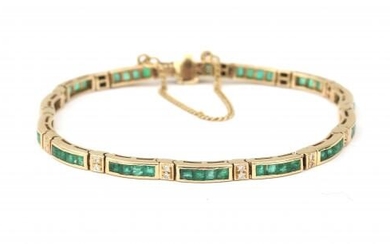 A 14 karat gold emerald and diamond bracelet. Featuring twenty eight brilliant cut diamonds and carré cut emeralds. Tongue clasp and safety chain. Gross weight: 10 g.