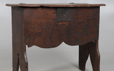 A 17TH CENTURY AND LATER RAISED OAK COFFER.