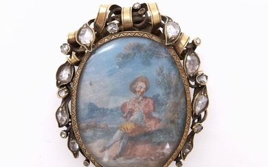 A 17th CENTURY 18K yellow gold brooch presenting a painted miniature of a bucolic scene with a flute player, surrounded by garlands wrapped in ribbons and adorned with eighteen rose-cut diamonds. Height: 5.7 cm. Width: 4.7 cm. Estimated weight...