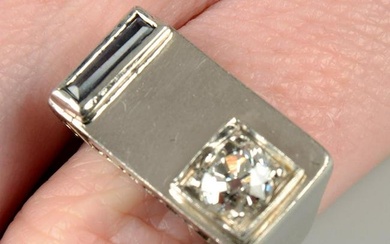 A 1940s gold old-cut diamond and sapphire tank ring.Estimated diamond weight 0.70ct, G-H colour, SI