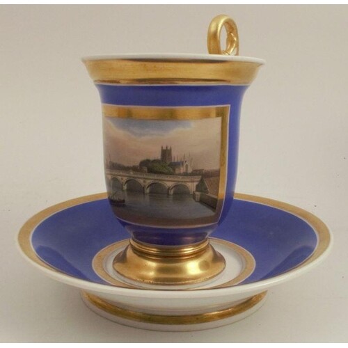 A 19th century French porcelain cup and saucer, with a blue ...