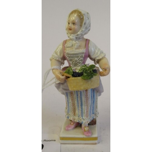 A 19th/20thC Meissen porcelain figure, a girl wearing a flor...