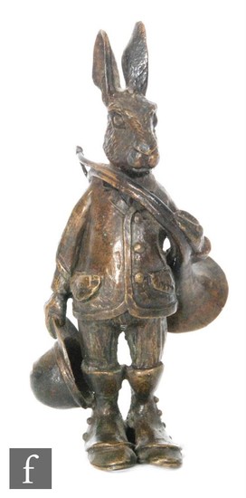 A 20th Century bronze desk stand modeled as Brer Rabbit hold...