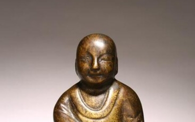 A CHINESE BRONZE FIGURE OF SEATED ARHAT