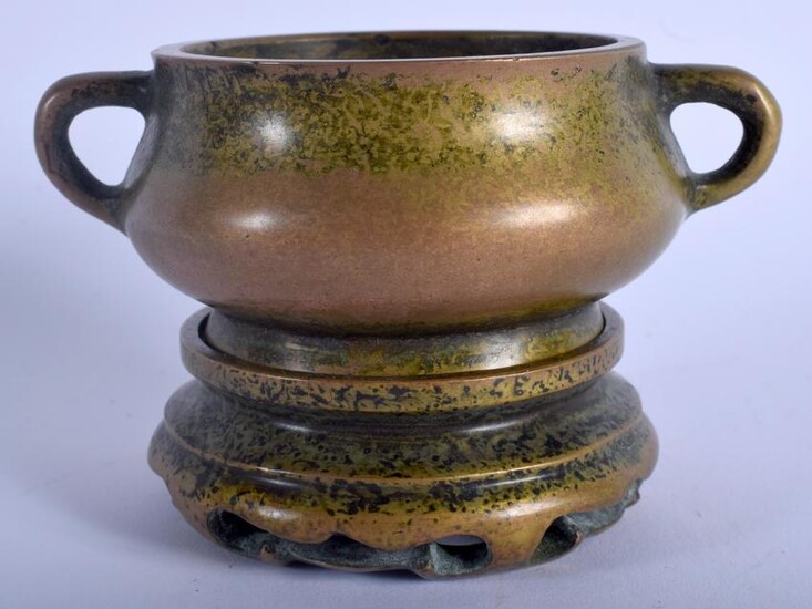 A CHINESE TWIN HANDLED BRONZE CENSER ON STAND 20th