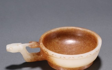 A Chinese Carved Jade Cup with Handle