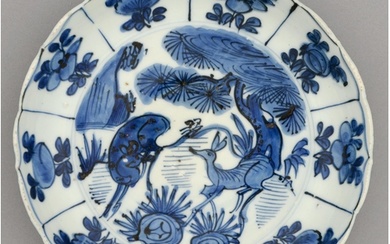 A Chinese blue and white Swatow Ware dish, 17th c, with gent...