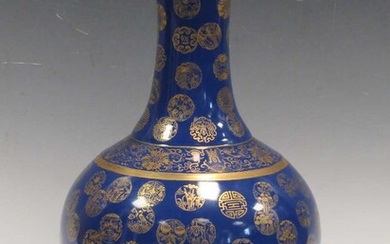 A Chinese bottle vase, the blue ground body gilt with mons, 40cm highCondition report: Rubbing to