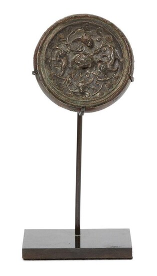A Chinese miniature silver sheet-inlaid bronze circular mirror, Tang dynasty,...
