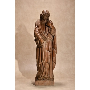 A Continental, probably French carved and stained beechwood model of a female saint