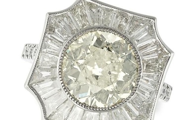 A DIAMOND DRESS RING in platinum, set with an old European cut diamond of 3.81 carats in a border of