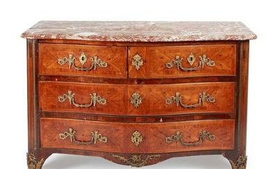A FRENCH REGENCE KINGWOOD, GILT METAL, AND ORMOLU MOUNTED MARBLE TOPPED COMMODE MID 18TH CENTURY