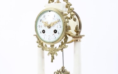 A French gilt-metal and white marble mounted pedestal striking mantle clock on ebonised base