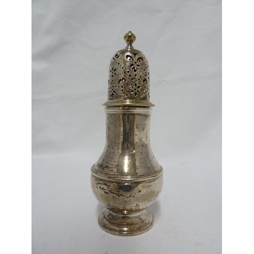 A George I silver caster, of baluster form, the pull off cov...
