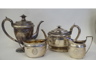 A George III silver five piece tea set of oval form with eng...