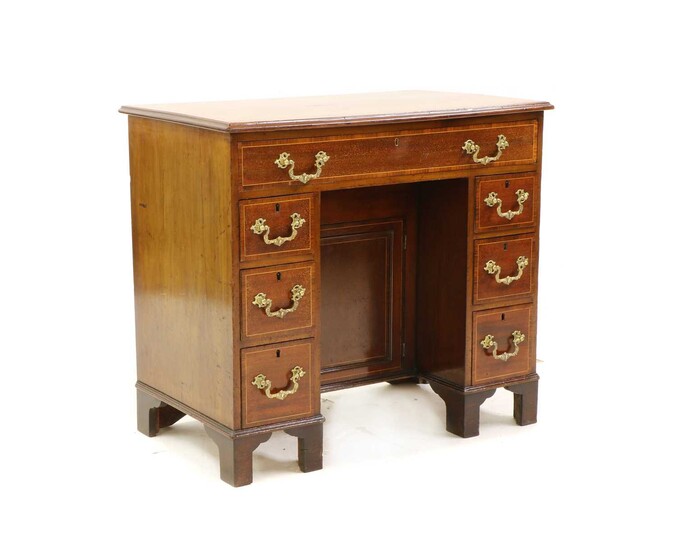 A George III style mahogany, strung and crossbanded kneehole desk