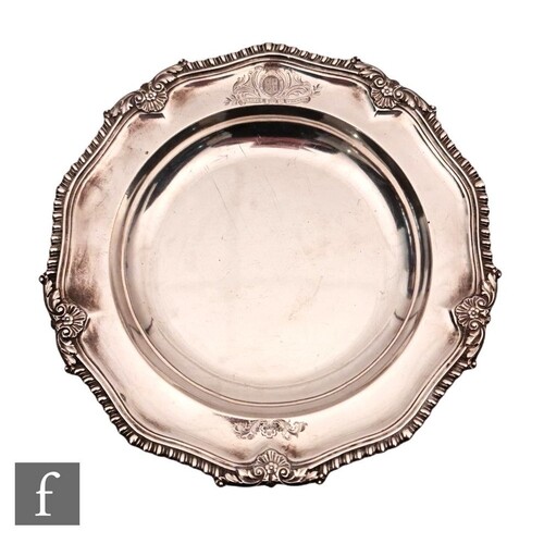 A George IV hallmarked silver shallow plate of plain form wi...
