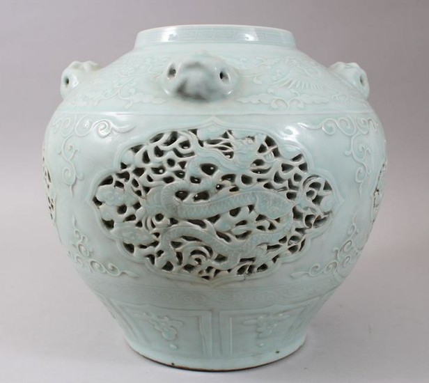 A LARGE CHINESE CELADON GROUND PIERCED MING STYLE