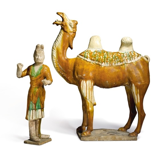 A LARGE SANCAI-GLAZED POTTERY FIGURE OF A CAMEL AND GROOM TANG DYNASTY