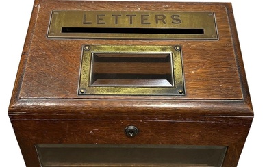 A LATE VICTORIAN OAK POSTBOX The slope top with...