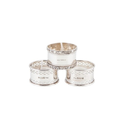 A MODERN PAIR OF SILVER NAPKIN RINGS, with open pierced deco...