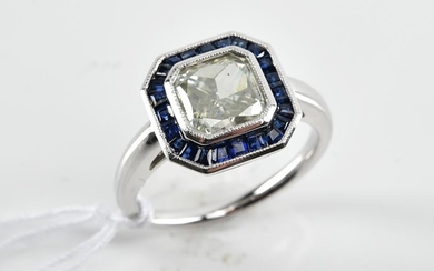 A MOISSANITE AND SAPPHIRE DRESS RING, MOISSANITE ESTIMATED WEIGHT 1.24CTS IN 18CT WHITE GOLD, SIZE M