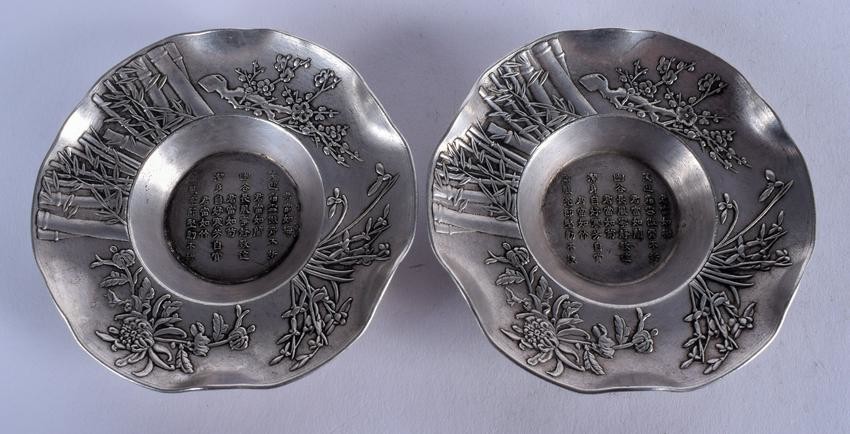 A PAIR OF CHINESE SILVERED BRONZE DISHES. 10 cm wide.