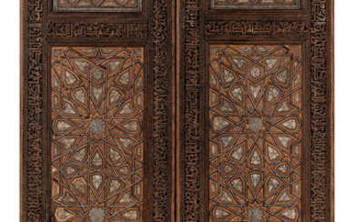 A PAIR OF IVORY-INLAID WOODEN DOORS, IRAN, 18TH CENTURY, THE CALLIGRAPHIC BORDERS CARVED LATER