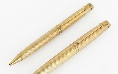 A Pair of Limited Edition Caran d'Ache Gold Plated Pens