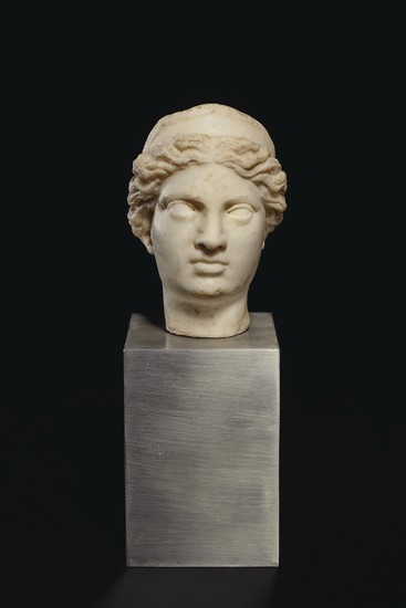 A ROMAN MARBLE HEAD OF A GODDESS, CIRCA 1ST-2ND CENTURY A.D.