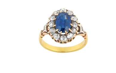 A Sapphire and Diamond Cluster Ring the oval cut sapphire...